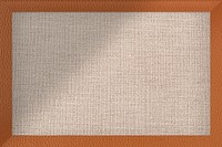 Orangish brown leather frame on brown fabric textured bacgkround vector