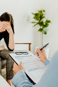 Woman filling out health care insurance form mockup during the coronavirus pandemic