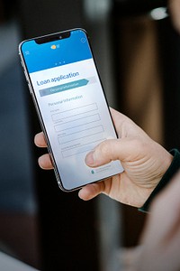 Man applying for a loan on a mobile phone mockup during the coronavirus pandemic