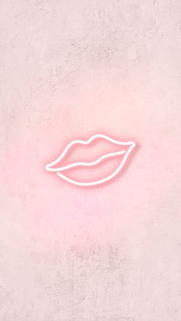 Neon light kiss sign on pink background
