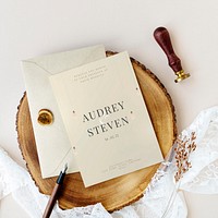 Wedding invitation flat lay on the wooden decoration plate