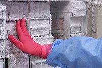 A technician placing the repackaged influenza samples into a cold&ndash;storage environment within the laboratory setting.