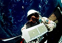 Astronaut Edwin E. Aldrin Jr., pilot for the Gemini-12 spaceflight, removes micrometeoroid package for return to the spacecraft during extravehicular activity (EVA). Original from NASA . Digitally enhanced by rawpixel.