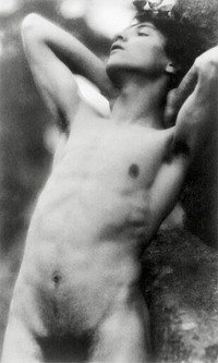 Nude photography of naked man: Portrait Photograph of nude youth with laurel wreath against rock with hands behind neck, cropped at thighs (1907) by Fred Holland. Original from Library of Congress. Digitally enhanced by rawpixel.
