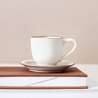 White tea cup on a book