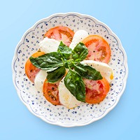 Caprese salad on plate, food photography psd