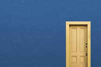 Blue wall background, yellow panel door, home interior