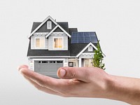 Hand presenting solar-powered house, home loan campaign psd