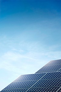 Renewable energy background, solar panels with blue sky