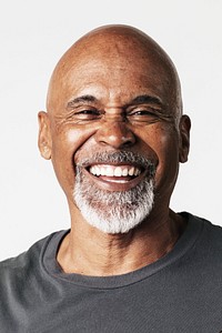 Bald senior man laughing in a studio shoot 