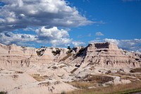 Badlands National Park.  244,000 acres of sharply eroded buttes, pinnacles, and spires. Bison, bighorn sheep, endangered black-footed ferrets, and swift fox roam one of the largest, protected mixed-grass prairies in the United States.