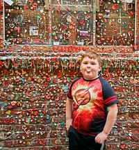 Six-year-old Gregorio Drozco III does what a lot of people do in a Seattle, Washington, alley  He blows a bubble, preparatory to wadding up his gum and sticking it to a wall next to the Market Theatre that has become a kitschy tourist attraction.