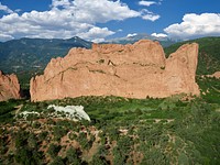 Aerial view of some of the standout red-rock formations at the Garden of the Gods, a municipally owned and free park in Colorado Springs, Colorado.  For half a century or more, photographs of this place as well as the bridge over the chasm known as the Royal Gorge and Pikes Peak Mountain above Colorado Springs have served as powerful tourist magnets for the state.