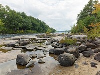The Limington Rapids on the rocky Saco River, near Limington, Maine, are a family attraction.  There's a venerable picnic area with rain-worn roof shelters up the bank from here.