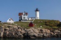 The Cape Neddick lighthouse -- known locally and affectionately as the Nubble Light -- built in 1879 and still in use in York, Maine.  A nubble is a small outcropping of rocks by the sea.