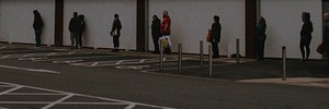 People lining up outside the supermarket social distancing during coronavirus pandemic. MARCH 30, 2020 - BRISTOL, UK