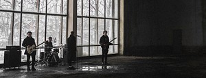 Rock band rehearsing in an abandoned building social banner