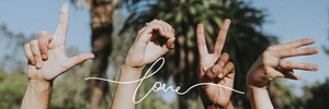 Hands forming the word love