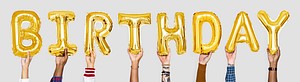Yellow gold alphabet balloons forming the word birthday