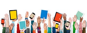 Diverse Hands Holding Digital Devices