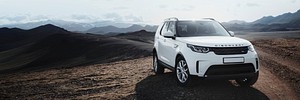 2019, Iceland, White Landrover driving in the countryside social banner