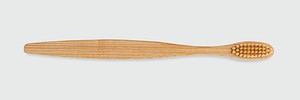 Natural bamboo toothbrush on off white background banner