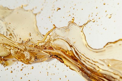 Golden liquid splash close-up | Free Photo - rawpixel