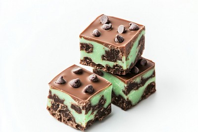 Three mint chocolate chips fudge cubes stacked confectionery dessert brownie.