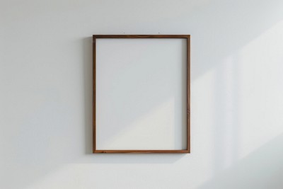 Empty wooden frame on wall