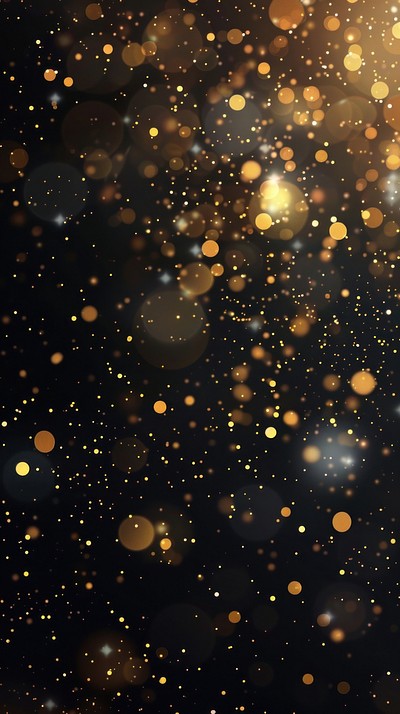 A dark background with gold glitter falling medication astronomy lighting.