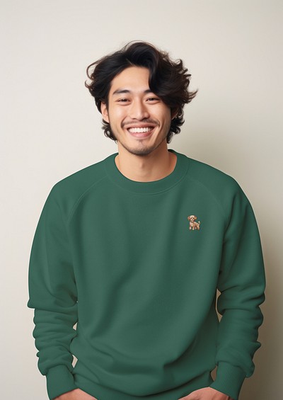 Smiling man in green sweatshirt