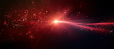 A bright crimson starburst light background particles.