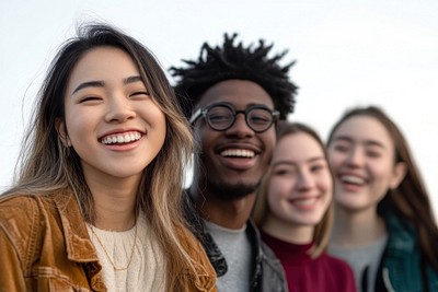 Multiethnic students laughing together smiling.