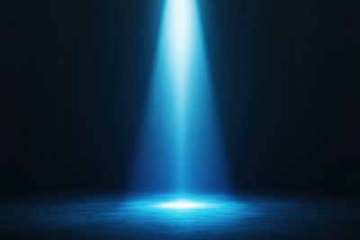 An isolated blue light beam effect lighting spotlight stage.