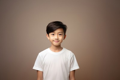 A young asian boy wearing a white T-shirt background portrait t-shirt.