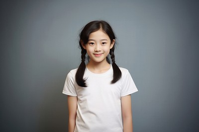 A young asian girl wearing a white T-shirt background smiling female.