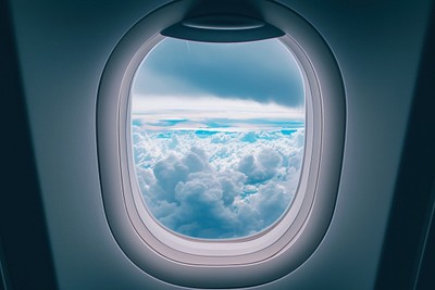 Large window see raining cloudscape airplane aircraft porthole.