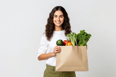 Paper bag with of vegetables portrait holding adult.