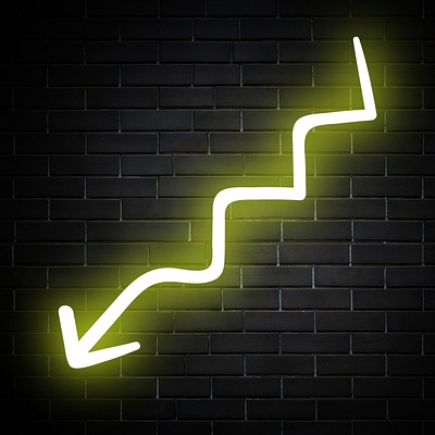 Neon yellow zigzag arrow sign on brick wall