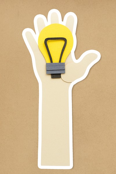 Hand holding a light bulb paper craft sticker