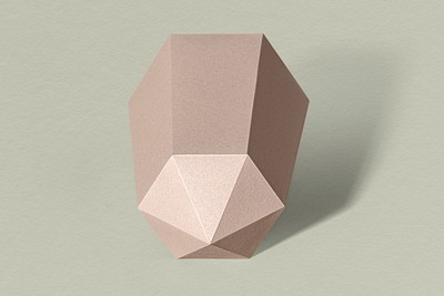 Pink hexagonal prism  paper craft on a sage green background