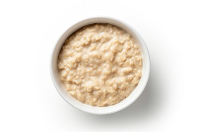 A bowl of oats porridge breakfast food white background. 