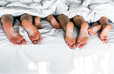 Whole family sharing a bed | Premium Photo - rawpixel