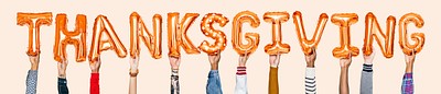 Hands holding Thanksgiving word in balloon letters