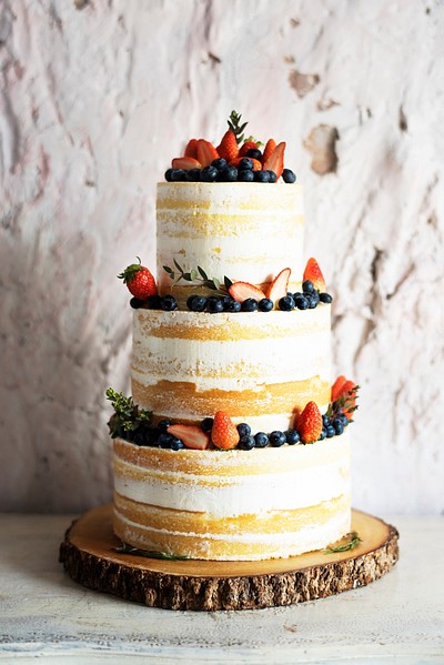 White Wedding Cake with Berries | Premium Photo - rawpixel