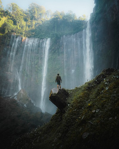 Man standing Tumpak Sewu Waterfalls, | Premium Photo - rawpixel