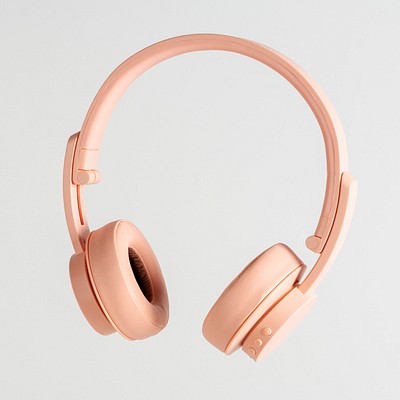 Pastel pink wireless headphone mockup on a gray background