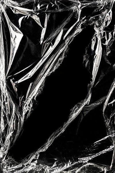 Wrinkled plastic wrap texture on a black background