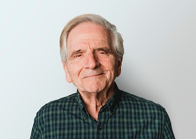 Elderly Caucasian man with white hair smiling on gray background mockup