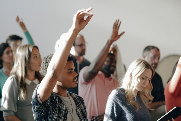 People raising their hands in a seminar | Premium Photo - rawpixel